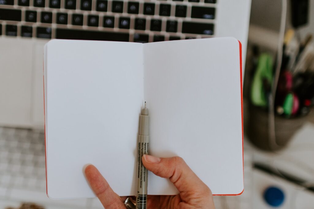 Empty notebook in front of a desk